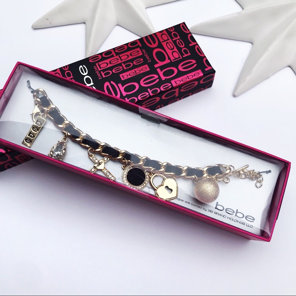 Bebe gold and black charm bracelet cross jewel